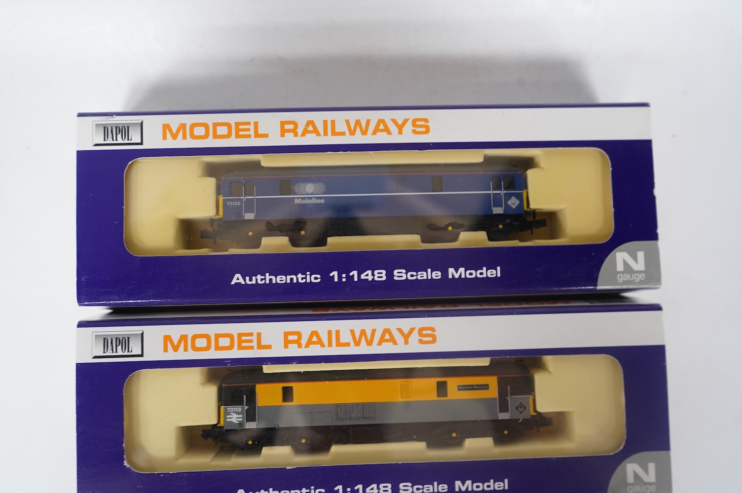 Three boxed Dapol N gauge railway Class 73 electro-diesel locomotives; 73119 Kentish Mercury (ND-022a), 73129 City of Winchester (ND-012a) and 73133 (ND-021b). Condition - good.